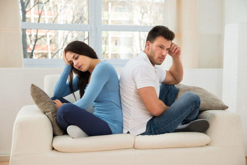 Unhappy couple exploring how to repair their relationship after cheating and betrayal.