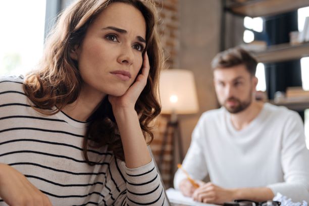 Woman looking off wondering what she can do to help her man understand her better.