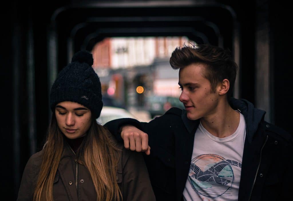 Couple walking thinking about getting relationship counseling.