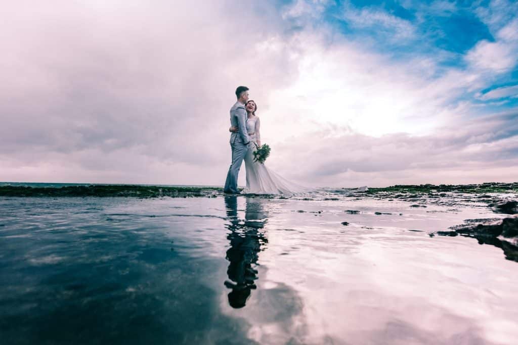 Happy married couple on the beach.